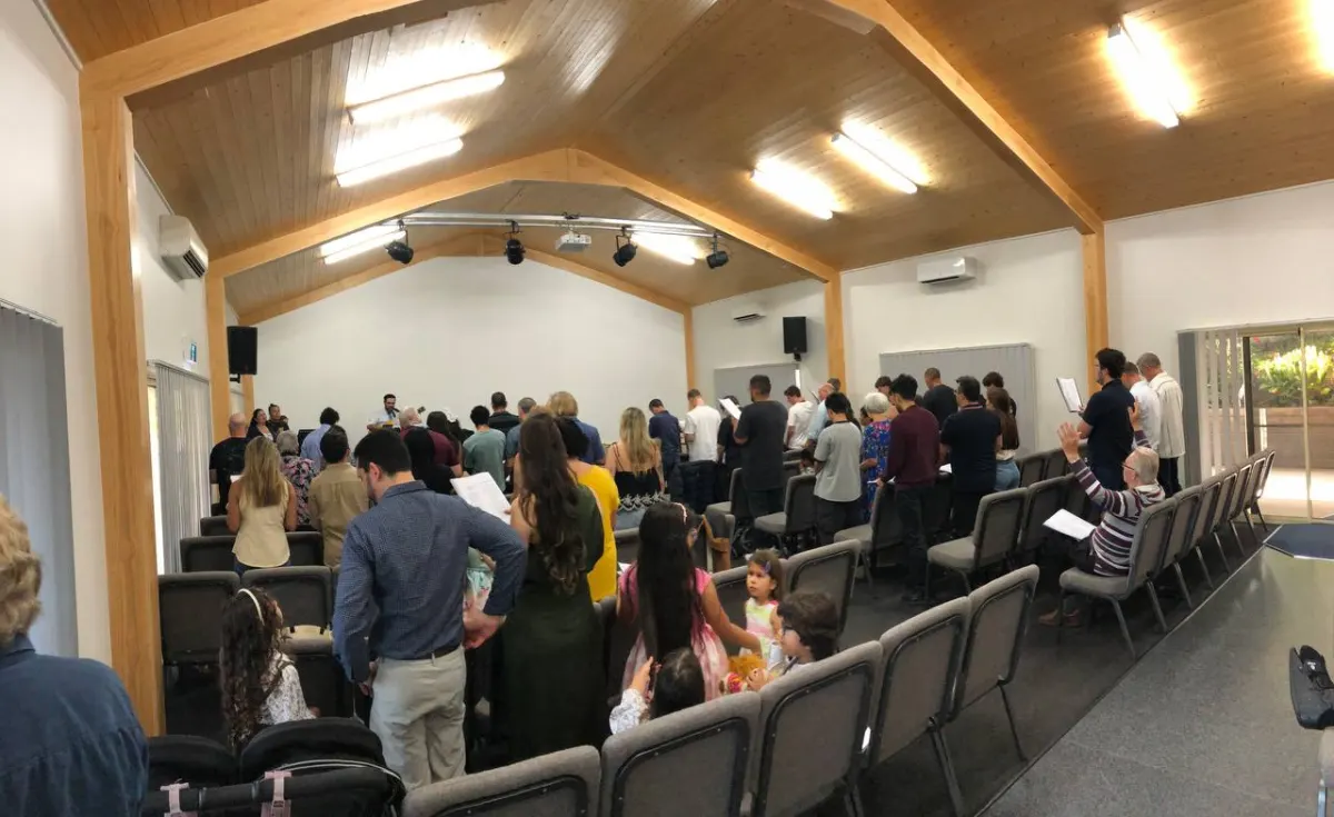 The congregation standing to sing during Sunday worship at Cornerstone Reformed Baptist Church, Gaven
