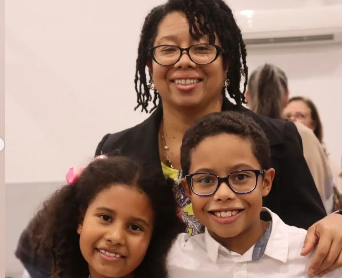 A mother with two children at a church fellowship gathering